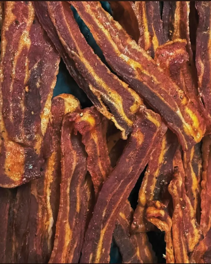 Crisp strips of slow-roasted bacon