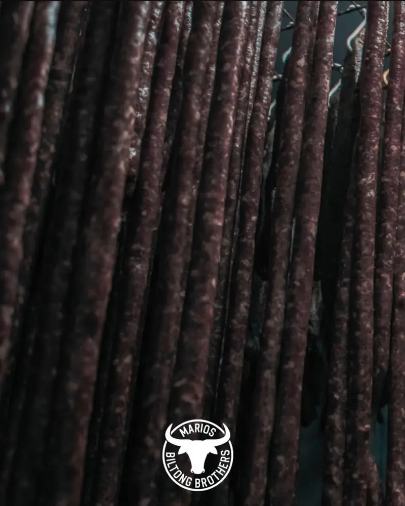 Droëwors hanging in rows in the drying room